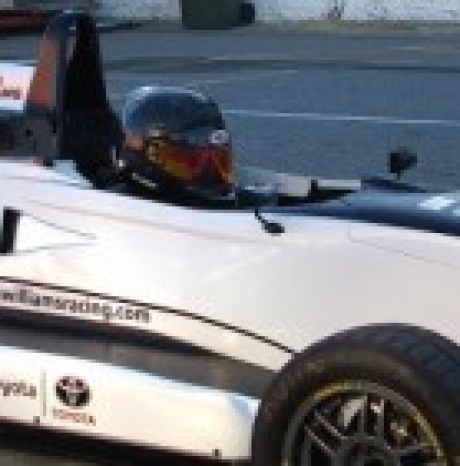 Calan Williams behind the racing wheel