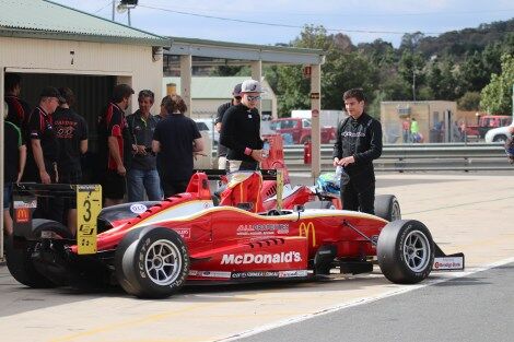 Calan Williams standing next to the car