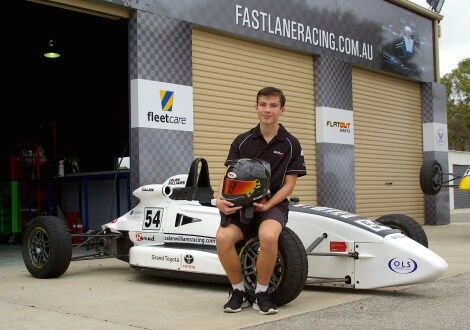 Calan Williams sitting on his car