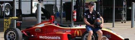 Calan Williams sitting on the macdonalds car