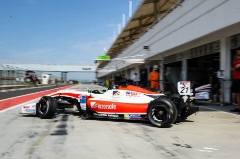 Calan Williams in front of the garage