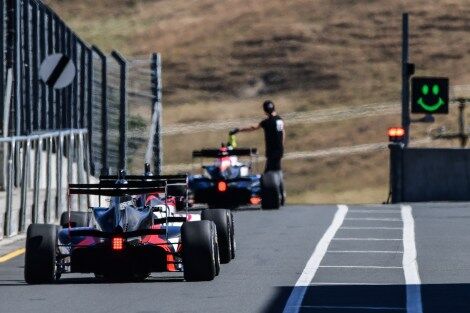 Formula 3 cars all lined up ready to race