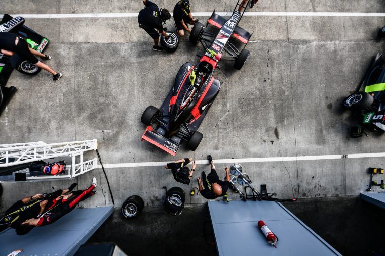 Birds eye view of Calan Williams racing in the pits